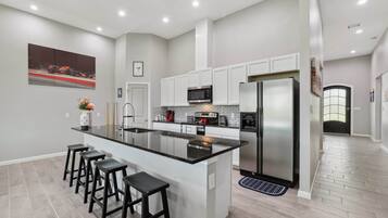 Fridge, stovetop, coffee/tea maker