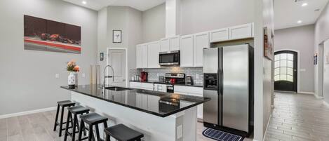 Fridge, stovetop, coffee/tea maker