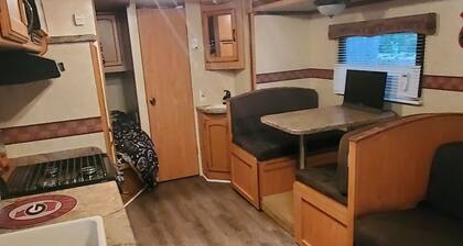 Camper sleeps 6 Nestled in a Wooded Area. Pet Friendly, Fire Pit, spacious