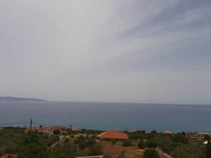 A coastal landscape with houses and a view of the sea.