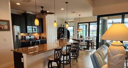 A 100+ reviews Family friendly home on canal with gulf access and heated pool!