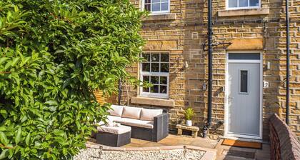 A wonderful stone built cottage located on a quiet row in Clayton West.