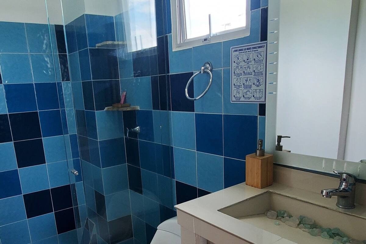 family suite | bathroom | shower, rainfall showerhead, eco-friendly toiletries, hair dryer