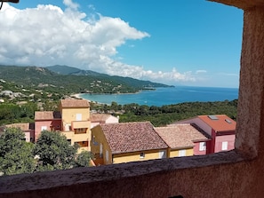 A coastal view with buildings and a clear sky.