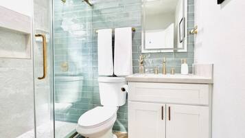 Shower, hair dryer, towels, soap