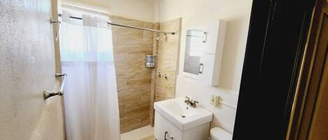 Shower, towels, soap, shampoo
