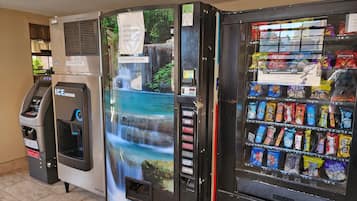 A vending machine with snacks and a water dispenser.