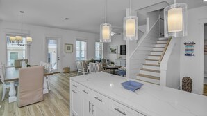 A spacious kitchen with a large island, white cabinetry, and pendant lighting. - Private Heated Pool | FREE Golf Cart | 5 BR Home | 5 Outdoor Spaces | Near Dune Allen Beach (Santa Rosa Beach)