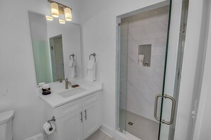 Combined shower/tub, hair dryer, towels, soap