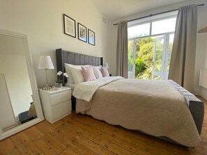 1 bedroom, desk, iron/ironing board, travel crib