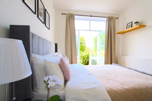 1 bedroom, desk, iron/ironing board, travel crib