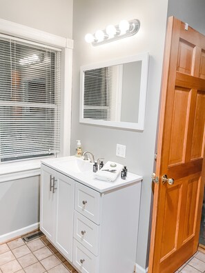 Jetted bath, hair dryer, towels, soap