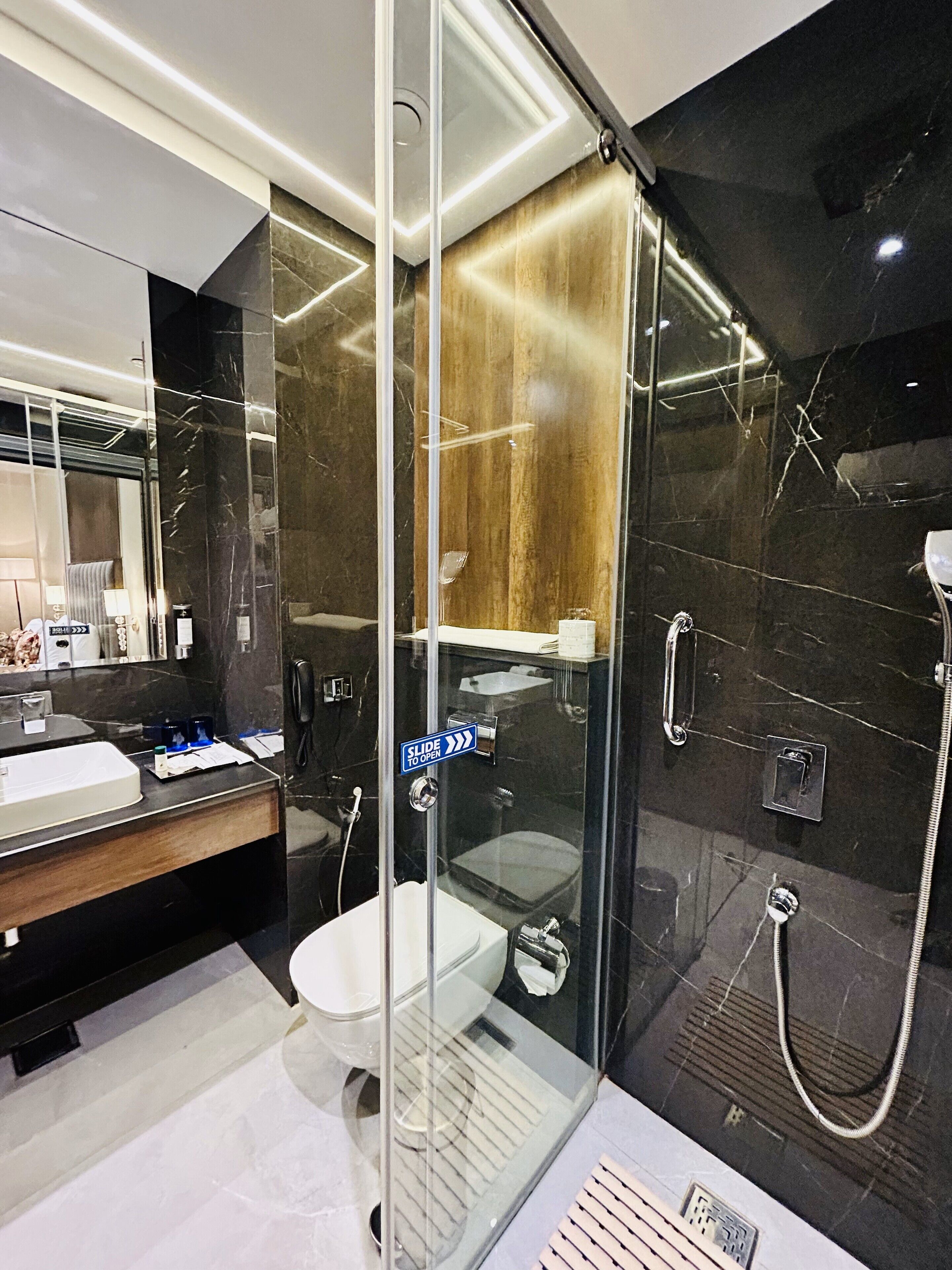 deluxe room, 1 king bed | bathroom | shower, rainfall showerhead, free toiletries, hair dryer