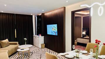 Suite, 1 King Bed | Living area | 43-inch LED TV with digital channels
