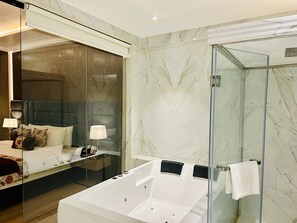 Suite, 1 King Bed | Bathroom | Shower, rainfall showerhead, free toiletries, hair dryer