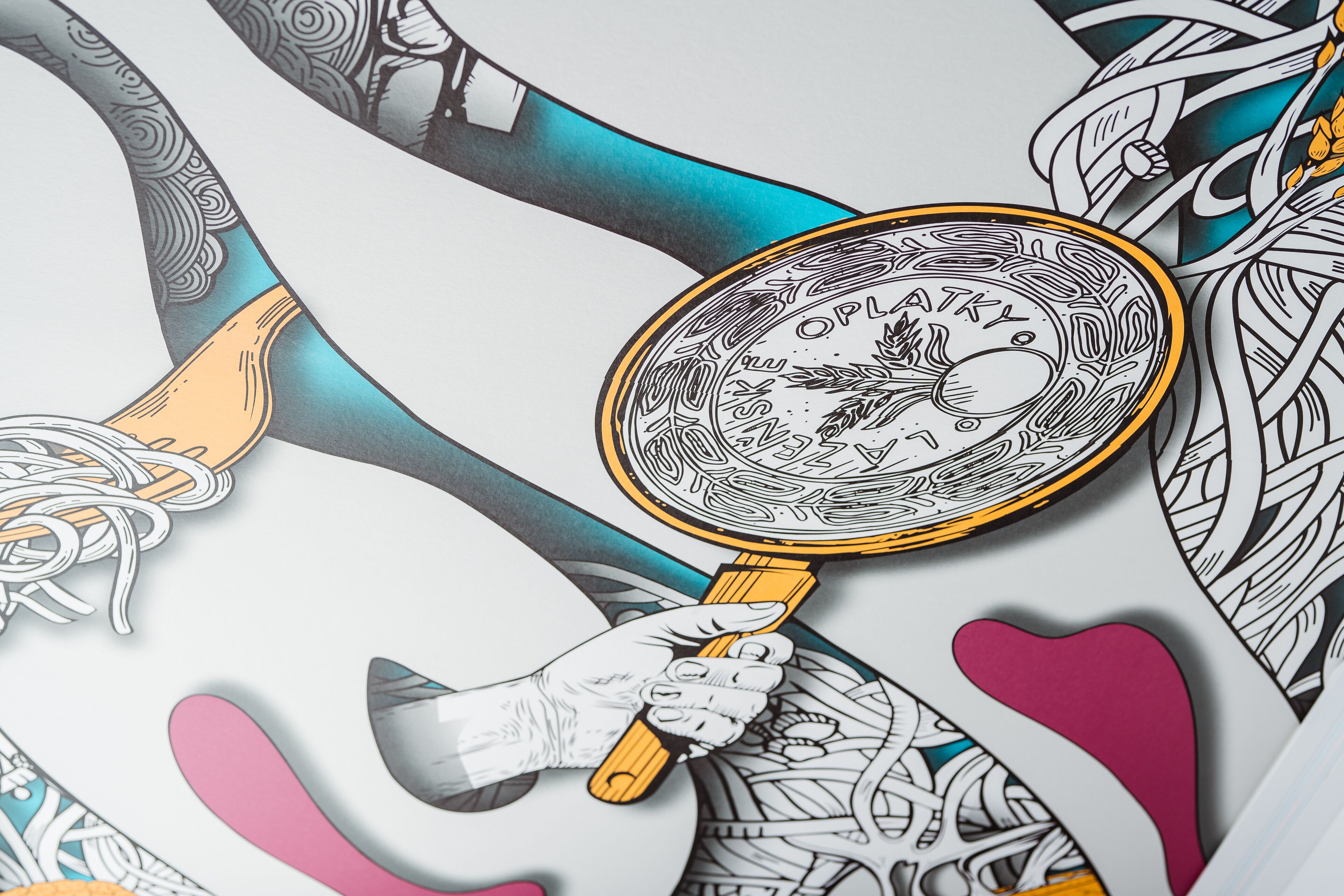 A hand holding a magnifying glass over a detailed illustration.