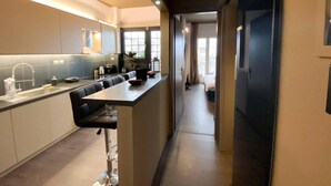 Apartamento, várias camas | Cozinha privada | Micro-ondas, fogão, cooktop, chaleira elétrica