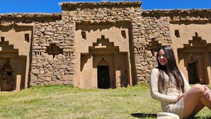A stone building with multiple doorways and a clear sky. - LUNA DEL TITIKAKA LODGE (Moon Island)
