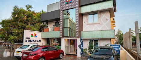 A hotel with a signboard for Sree Kumaran Desirable.