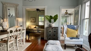 A spacious living room with a dining area, a large plant, and a cozy seating arrangement. - New listing! Riverside Retreat on the Choptank River (Cambridge)