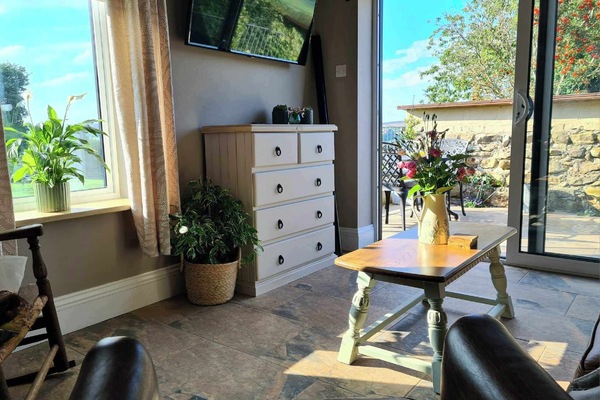 Rear living room with stunning views plus patio