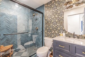 Shower, hair dryer, towels, soap