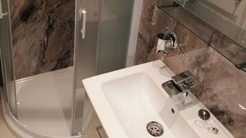 Shower, hair dryer, towels