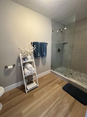 Shower, hair dryer, towels, soap