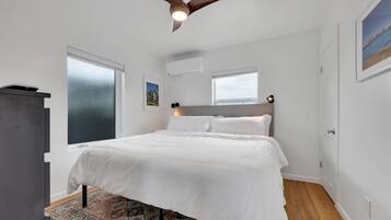 1 bedroom, desk, iron/ironing board, travel crib