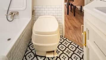 Bathtub, hair dryer, towels
