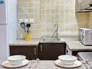 Fridge, stovetop, dishwasher, highchair