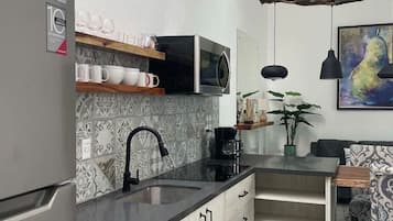 Fridge, microwave, stovetop, coffee/tea maker