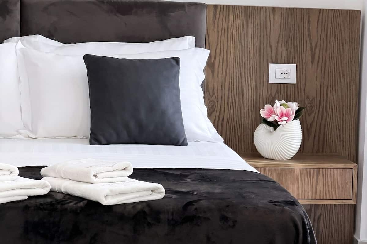 Premium bedding, desk, laptop workspace, free WiFi