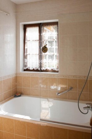 Bathtub, hair dryer, towels