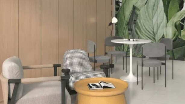 Un intérieur moderne avec un mur recouvert de panneaux en bois, une table ronde et plusieurs chaises.