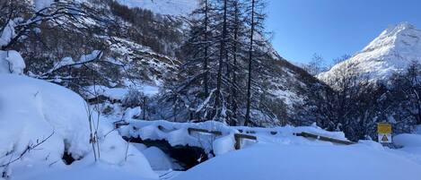 A snowy mountain landscape with a clear sky.