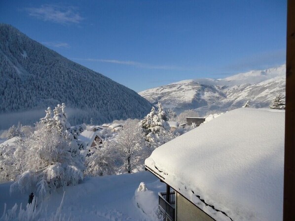 A snow-covered mountain landscape with a building partially obscured by snow. - LES 4 Saisons - Seez (SEEZ)