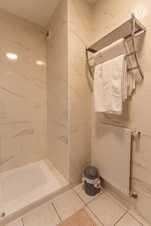 Bathtub, hair dryer, towels