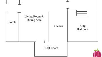 A floor plan with a Porch, Living Room & Dining Area, Kitchen, King Bedroom, and Rest Room.