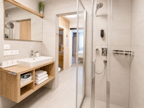 Shower, hair dryer, towels, toilet paper
