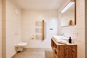 Shower, hair dryer, towels, toilet paper