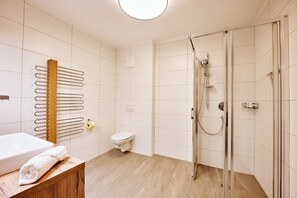 Shower, hair dryer, towels, toilet paper
