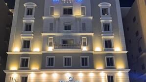 A multi-story hotel with a prominent sign reading "Ocean View Hotel Al Zahra." - Ocean View Al Zahra (Jeddah)