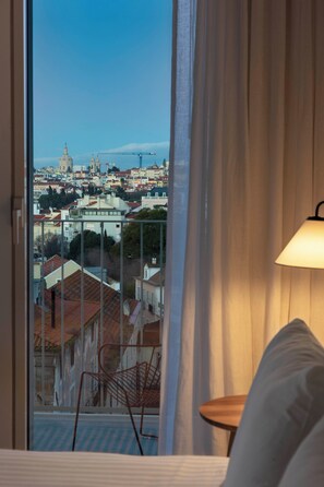 Balcony with City View | Down comforters, in-room safe, blackout drapes, soundproofing