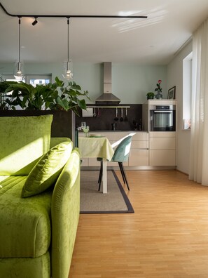 Deluxe Apartment, 2 Bedrooms, Beachfront | Living area | Flat-screen TV, heated floors - LOIDLs Guesthouse (Traunkirchen)