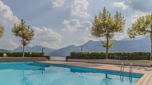 A swimming pool with a view of mountains in the background.