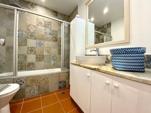Bathtub, hair dryer, towels