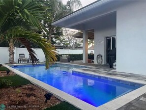 Outdoor pool, a heated pool - Deerfield Beach Vacation Home in "The Cove" (Deerfield Beach)