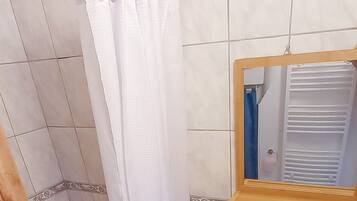 Shower, towels, soap, toilet paper