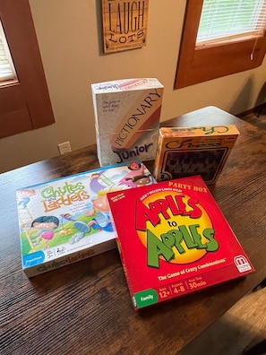 Enjoy family game nights with a selection of board games, including Chutes and Ladders, Pictionary Junior, and Apples to Apples.